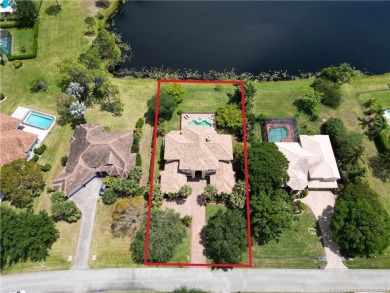 PRIVATE LAKESIDE RETREAT - This updated 5 BR, 6 bath, 4 garage on The Cape Club of Palm City in Florida - for sale on GolfHomes.com, golf home, golf lot