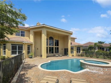PRIVATE LAKESIDE RETREAT - This updated 5 BR, 6 bath, 4 garage on The Cape Club of Palm City in Florida - for sale on GolfHomes.com, golf home, golf lot