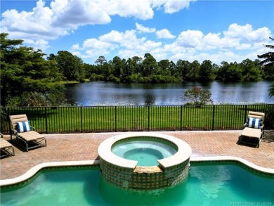 PRIVATE LAKESIDE RETREAT - This updated 5 BR, 6 bath, 4 garage on The Cape Club of Palm City in Florida - for sale on GolfHomes.com, golf home, golf lot