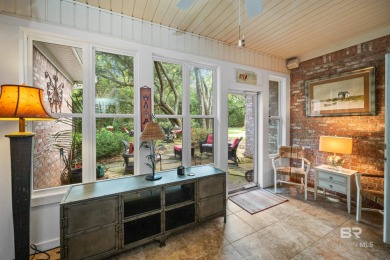 Welcome to this beautifully maintained 3-bedroom, 2-bath home on Peninsula Golf and Racquet Club in Alabama - for sale on GolfHomes.com, golf home, golf lot