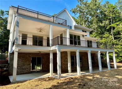 Stately new Lake Tillery home nestled in a quit cove in the on The Tillery Tradition Country Club in North Carolina - for sale on GolfHomes.com, golf home, golf lot