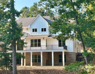 Stately new Lake Tillery home nestled in a quit cove in the on The Tillery Tradition Country Club in North Carolina - for sale on GolfHomes.com, golf home, golf lot