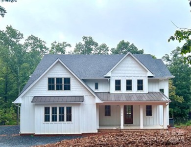 Stately new Lake Tillery home nestled in a quit cove in the on The Tillery Tradition Country Club in North Carolina - for sale on GolfHomes.com, golf home, golf lot