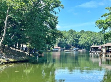 Stately new Lake Tillery home nestled in a quit cove in the on The Tillery Tradition Country Club in North Carolina - for sale on GolfHomes.com, golf home, golf lot