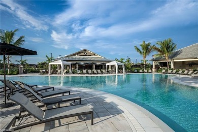 ****SIGNIFICANT PRICE IMPROVEMENT!*** JUST PACK YOUR PERSONAL on The Golf Club At Fiddlers Creek in Florida - for sale on GolfHomes.com, golf home, golf lot