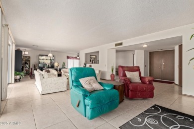 The epitome of comfort nestled within a serene 55+ adult on Stardust Golf Course in Arizona - for sale on GolfHomes.com, golf home, golf lot