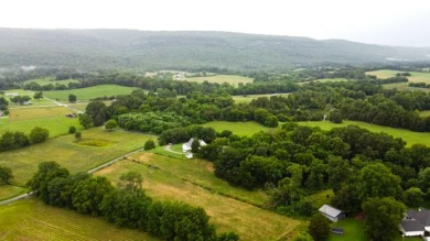 Nestled on 10.74 acres, this charming 1900s farmhouse offers on  in Tennessee - for sale on GolfHomes.com, golf home, golf lot
