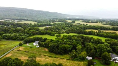 Nestled on 10.74 acres, this charming 1900s farmhouse offers on  in Tennessee - for sale on GolfHomes.com, golf home, golf lot