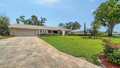 Gorgeously updated and hurricane-ready, this lakefront pool home on The Meadows Golf and Country Club in Florida - for sale on GolfHomes.com, golf home, golf lot