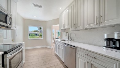 Gorgeously updated and hurricane-ready, this lakefront pool home on The Meadows Golf and Country Club in Florida - for sale on GolfHomes.com, golf home, golf lot