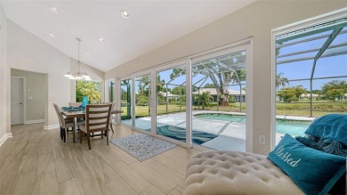 Gorgeously updated and hurricane-ready, this lakefront pool home on The Meadows Golf and Country Club in Florida - for sale on GolfHomes.com, golf home, golf lot