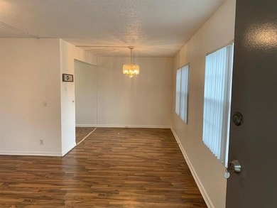 Beautiful corner unit featuring 2 bedrooms and 2 bathrooms with on Flamingo Lakes Country Club in Florida - for sale on GolfHomes.com, golf home, golf lot