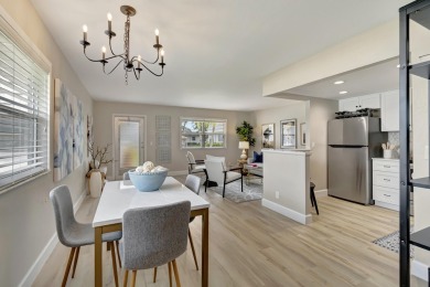 Enjoy serene water views from this fully remodeled ground-floor on Kings Point Golf - Executive in Florida - for sale on GolfHomes.com, golf home, golf lot