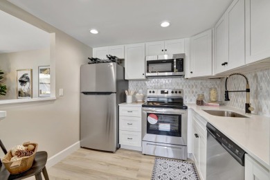 Enjoy serene water views from this fully remodeled ground-floor on Kings Point Golf - Executive in Florida - for sale on GolfHomes.com, golf home, golf lot
