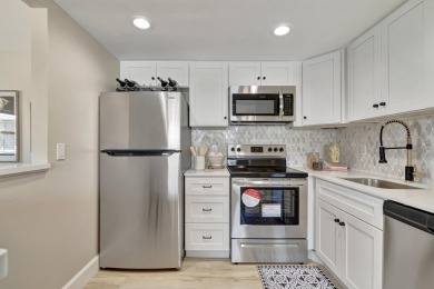Enjoy serene water views from this fully remodeled ground-floor on Kings Point Golf - Executive in Florida - for sale on GolfHomes.com, golf home, golf lot