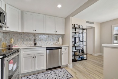 Enjoy serene water views from this fully remodeled ground-floor on Kings Point Golf - Executive in Florida - for sale on GolfHomes.com, golf home, golf lot