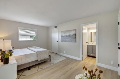 Enjoy serene water views from this fully remodeled ground-floor on Kings Point Golf - Executive in Florida - for sale on GolfHomes.com, golf home, golf lot