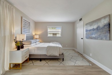 Enjoy serene water views from this fully remodeled ground-floor on Kings Point Golf - Executive in Florida - for sale on GolfHomes.com, golf home, golf lot