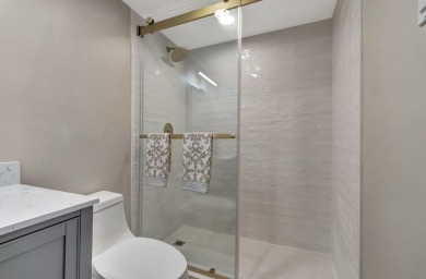 Enjoy serene water views from this fully remodeled ground-floor on Kings Point Golf - Executive in Florida - for sale on GolfHomes.com, golf home, golf lot