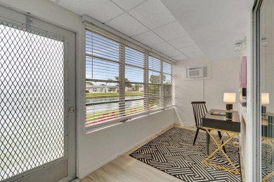 Enjoy serene water views from this fully remodeled ground-floor on Kings Point Golf - Executive in Florida - for sale on GolfHomes.com, golf home, golf lot