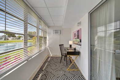 Enjoy serene water views from this fully remodeled ground-floor on Kings Point Golf - Executive in Florida - for sale on GolfHomes.com, golf home, golf lot
