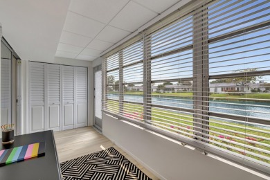 Enjoy serene water views from this fully remodeled ground-floor on Kings Point Golf - Executive in Florida - for sale on GolfHomes.com, golf home, golf lot