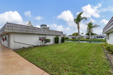 Enjoy serene water views from this fully remodeled ground-floor on Kings Point Golf - Executive in Florida - for sale on GolfHomes.com, golf home, golf lot