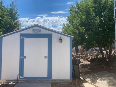 Premium lot with apple trees and shed.  Older, spacious 5th on Juniper Ridge R.V. Golf Resort in Arizona - for sale on GolfHomes.com, golf home, golf lot