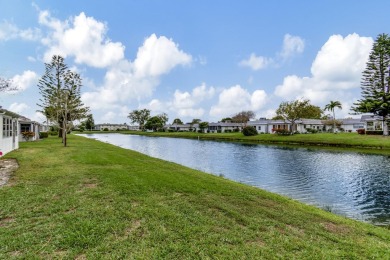 Enjoy serene water views from this fully remodeled ground-floor on Kings Point Golf - Executive in Florida - for sale on GolfHomes.com, golf home, golf lot