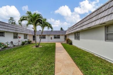 Enjoy serene water views from this fully remodeled ground-floor on Kings Point Golf - Executive in Florida - for sale on GolfHomes.com, golf home, golf lot