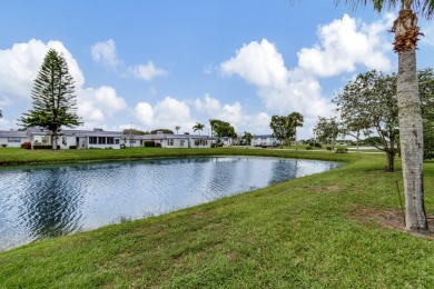 Enjoy serene water views from this fully remodeled ground-floor on Kings Point Golf - Executive in Florida - for sale on GolfHomes.com, golf home, golf lot