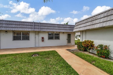 Enjoy serene water views from this fully remodeled ground-floor on Kings Point Golf - Executive in Florida - for sale on GolfHomes.com, golf home, golf lot