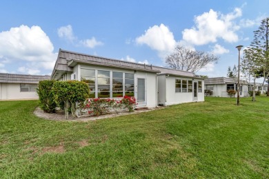Enjoy serene water views from this fully remodeled ground-floor on Kings Point Golf - Executive in Florida - for sale on GolfHomes.com, golf home, golf lot