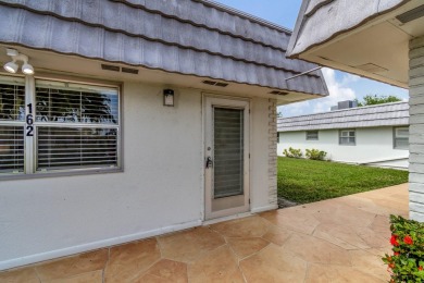 Enjoy serene water views from this fully remodeled ground-floor on Kings Point Golf - Executive in Florida - for sale on GolfHomes.com, golf home, golf lot