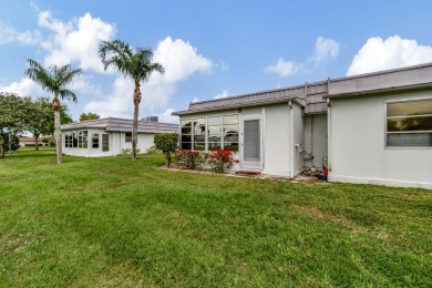 Enjoy serene water views from this fully remodeled ground-floor on Kings Point Golf - Executive in Florida - for sale on GolfHomes.com, golf home, golf lot