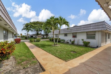 Enjoy serene water views from this fully remodeled ground-floor on Kings Point Golf - Executive in Florida - for sale on GolfHomes.com, golf home, golf lot
