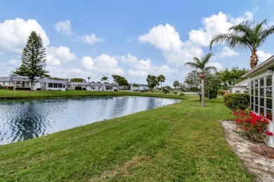 Enjoy serene water views from this fully remodeled ground-floor on Kings Point Golf - Executive in Florida - for sale on GolfHomes.com, golf home, golf lot