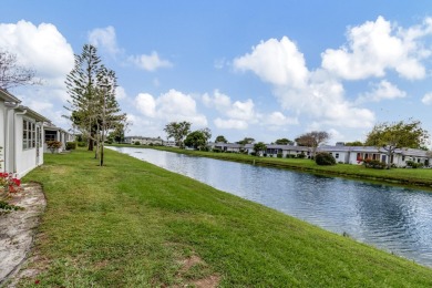 Enjoy serene water views from this fully remodeled ground-floor on Kings Point Golf - Executive in Florida - for sale on GolfHomes.com, golf home, golf lot