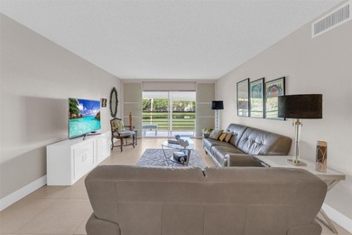 Discover this beautifully remodeled residence where elegance on Wynmoor Golf Course in Florida - for sale on GolfHomes.com, golf home, golf lot