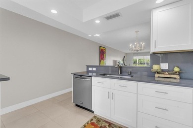 Discover this beautifully remodeled residence where elegance on Wynmoor Golf Course in Florida - for sale on GolfHomes.com, golf home, golf lot