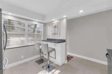 Discover this beautifully remodeled residence where elegance on Wynmoor Golf Course in Florida - for sale on GolfHomes.com, golf home, golf lot