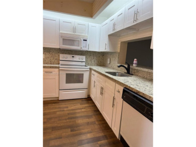 Welcome home to this stunning 2-bedroom, 2-bathroom FIRST FLOOR on Flamingo Lakes Country Club in Florida - for sale on GolfHomes.com, golf home, golf lot