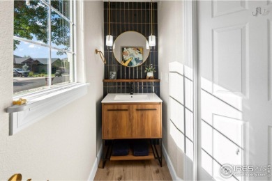 This stunning corner townhome backs to green space and offers a on Pelican Lakes Golf and Country Club in Colorado - for sale on GolfHomes.com, golf home, golf lot