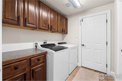 This stunning corner townhome backs to green space and offers a on Pelican Lakes Golf and Country Club in Colorado - for sale on GolfHomes.com, golf home, golf lot