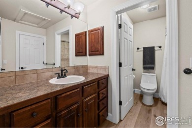 This stunning corner townhome backs to green space and offers a on Pelican Lakes Golf and Country Club in Colorado - for sale on GolfHomes.com, golf home, golf lot
