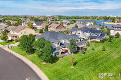 This stunning corner townhome backs to green space and offers a on Pelican Lakes Golf and Country Club in Colorado - for sale on GolfHomes.com, golf home, golf lot