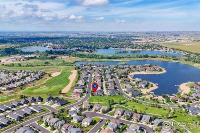 This stunning corner townhome backs to green space and offers a on Pelican Lakes Golf and Country Club in Colorado - for sale on GolfHomes.com, golf home, golf lot