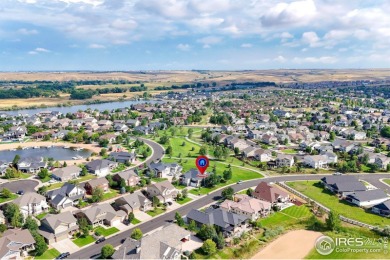 This stunning corner townhome backs to green space and offers a on Pelican Lakes Golf and Country Club in Colorado - for sale on GolfHomes.com, golf home, golf lot
