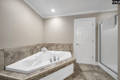 Welcome to this stunning all-brick home offering flexible living on Timberlake Country Club in South Carolina - for sale on GolfHomes.com, golf home, golf lot