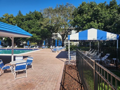 Updated and furnished 2 bed/2 bath unit. Open kitchen, shaker on Wynmoor Golf Course in Florida - for sale on GolfHomes.com, golf home, golf lot